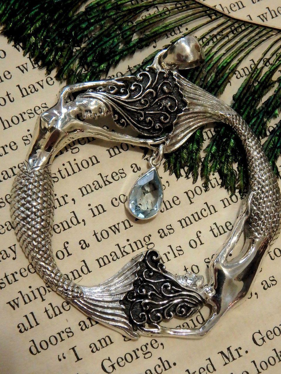  Dancing Mermaids & Faceted Blue Topaz Pendant in Sterling Silver (Includes Silver Chain)