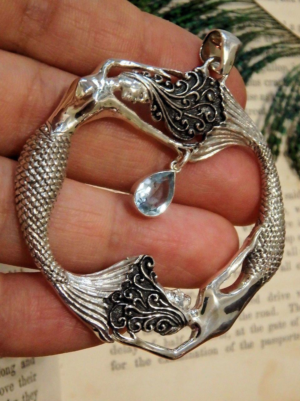  Dancing Mermaids & Faceted Blue Topaz Pendant in Sterling Silver (Includes Silver Chain)