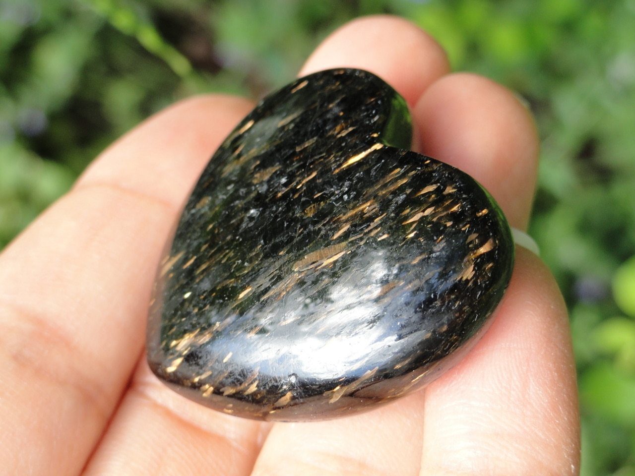 NUUMMITE HEART WITH GOLDEN FLASH FROM GREENLAND - Earth Family Crystals