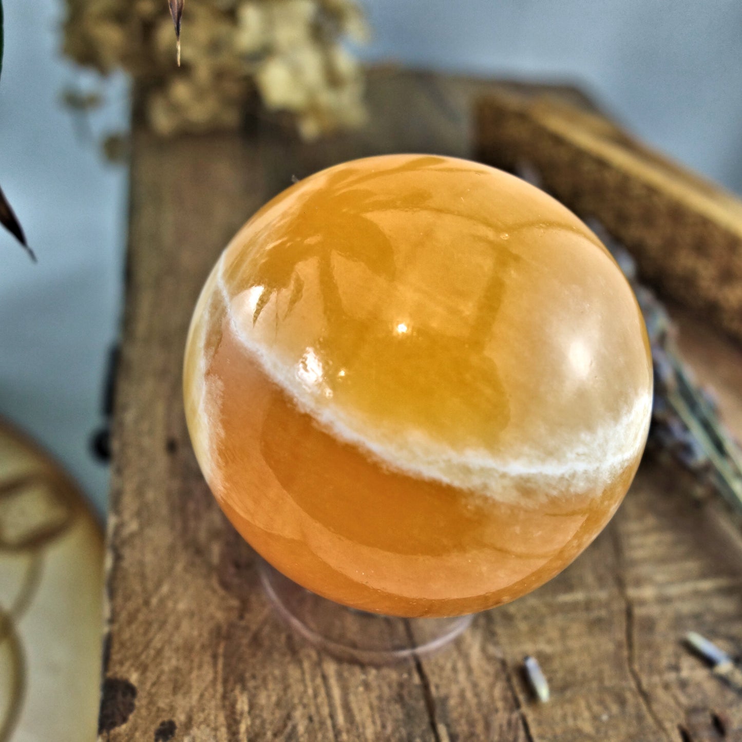Juicy Orange Calcite Sphere Carving - Earth Family Crystals