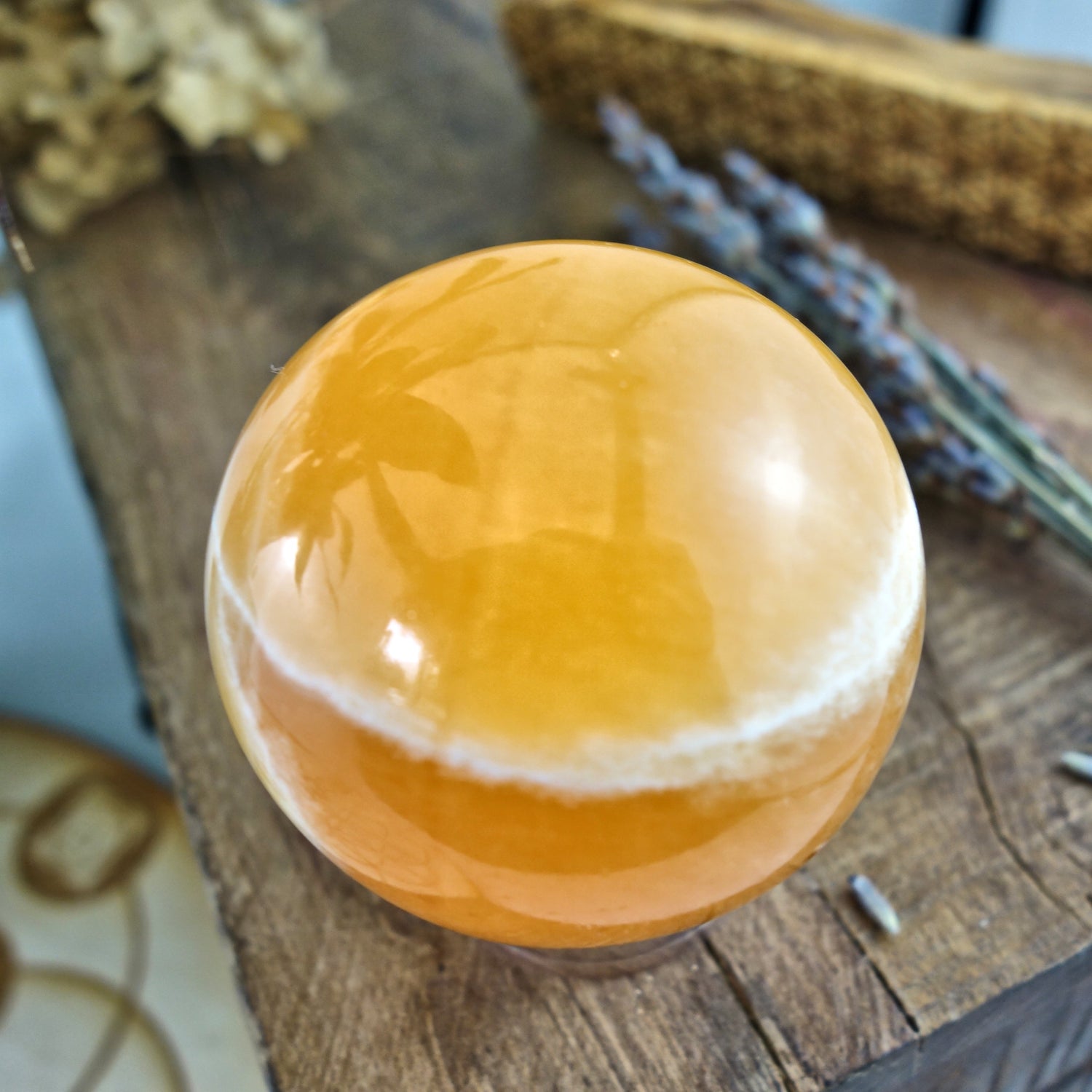 Juicy Orange Calcite Sphere Carving - Earth Family Crystals