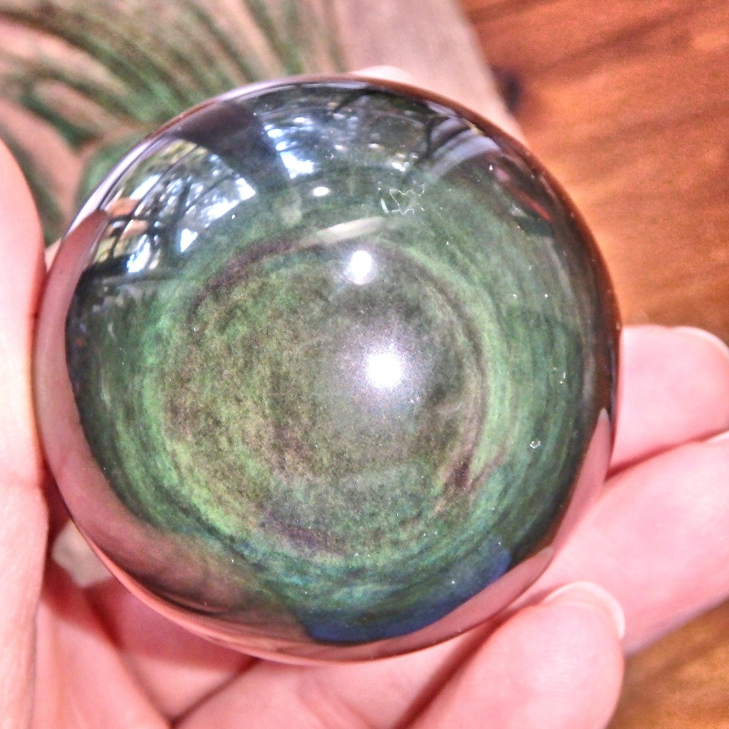 Mysterious Glimpses of Color Rainbow Obsidian Sphere Carving - Earth Family Crystals
